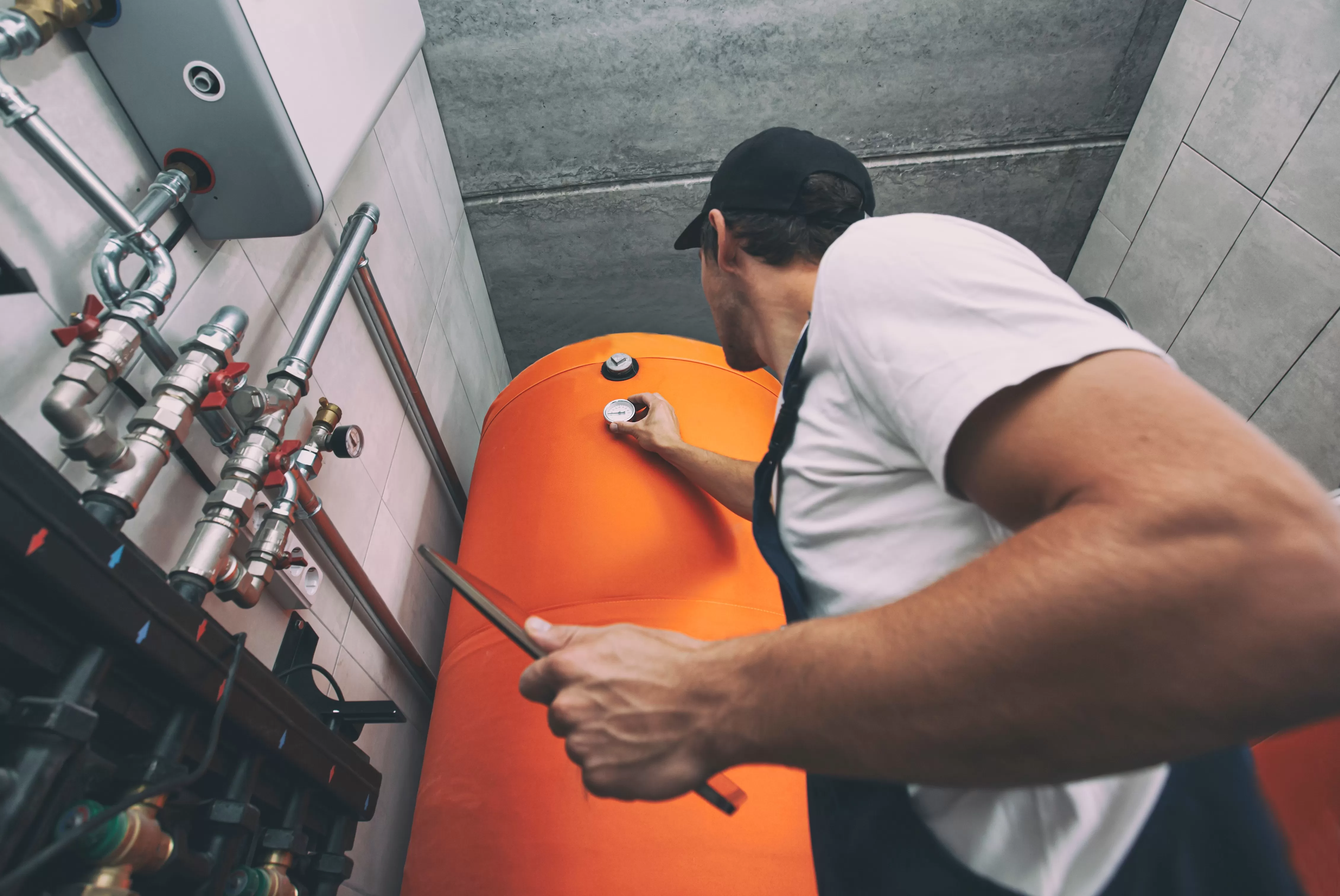 Technician installing energy efficient heating.